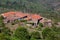 View of a typical northern Portuguese village, stone masonry houses and orange tile roofs in the middle of the mountains