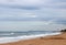 VIEW OF UMHLANGA ROCKS LIGHTHOUSE AND PIER ALONGSIDE THE INDIAN OCEAN WITH WHITE BREAKERS