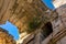 View under the arched vaults of ancient ruins overgrown with vegetation