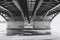 View under the bridge at frozen water, black and white image. Chernavsky bridge