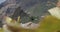 View from under the palm leaf on Masca Gorge and village. Tenerife, Canary Islands, Spain. Close-up footage