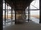 View underneath blackpool north pier showing the metal supporting structure and columns