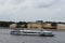 View of the University Embankment, the river tram and the Neva River from the English Embankment in St. Petersburg