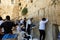 View of unknowns people praying front the Western wall in the old city of Jerusalem