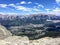 A view from up above of the beautiful town of Canmore, nestled in a valley in the Rocky Mountain range.