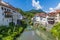 A view up the Selca Sora River towards the fourteenth century Capuchin Bridge in the town of Skofja Loka, Slovenia
