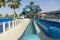 View up to Blue water Park twisted water slide amusement resort for luxury children and family vacations on a warm sunny tropical