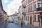 A view of Uzupio street in Uzupis, Vilnius, Lithuania. People are using green transportation: a bicycle and an electric