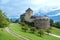 View of Vaduz Castle, the official residence of the Prince of Liechtenstein on the Alpine background