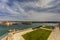 View on Valletta Grand harbor from the historic Upper Barraka garden area in Malta with historic line of cannons-Saluting Battery