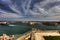 View on Valletta Grand harbor from the historic Upper Barraka garden area in Malta with historic line of cannons-Saluting Battery