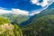 View of the valley behind Emosson Dam and Mont-Blanc peak on horizon near Swiss village of Finhaut