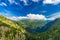 View of the valley behind Emosson Dam and Mont-Blanc peak on horizon near Swiss village of Finhaut