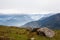 View of the valley in himalayan mountains covered with clouds