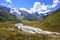 View of the valley in the mountains, glacier and river