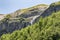 View of the valley of Sofia waterfalls with green mountain slopes, rocks and waterfalls