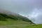 View of a valley on the Swiss Alps with a stable and cows - 1