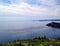 A view of the vast Atlantic Ocean with a boat passing by in the distance