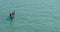 View of a Venetian gondolier driving a gondola in a Venetian canal. Venice, Italy.