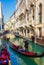 View of Venice canal Rio del Palazzo gondolas and crowded bridge Italy