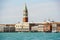 The view of Venice waterfront and St Mark`s Campanile and Doge`s Palace on a beautiful sunny day