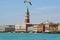 The view of Venice waterfront and St Mark`s Campanile and Doge`s Palace on a beautiful sunny day