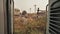 View from the vestibule of the Indian train to Indian villages.