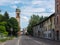 View of the via Emilia Road with Bell Tower of the Church of San Giacomo Apostolo in CadÃ¨ in the province of Reggio nell`Emilia,