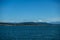 View of a vibrant blue sky above the San Juan Islands and the North Cascades mountain range from the Anacortes Ferry in Washington
