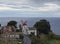 View on village Bretanha with old windmill called Red Peak Mill, Moinho do pico vermelho sea and clouds background, Sao