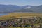 View on the village with colorful houses on the shore of Lake Baikal in the mountains in the summer.