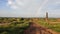 A view of village fields and brick factory after rain