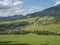 view on village Liptovska Luzna at the foothills of Low Tatras mountains with lush green meadow, forested hills and