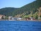 View of the village of Listvyanka from the lake Baikal. On the beach residential buildings hotels and many tourists