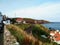 View of village with rock mountain at St Abbs Scotland