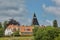 View of village of Svaneke in Denmark and modern three-legged water tower designed by Jorn Utzonon