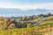 View of vineyards along Naramata Road on Naramata Bench with Okanagan Lake and mountains