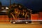 A view of a vintage classic American muscle sports car van pick up truck and light trails by traffic in Venice beach, California a