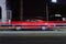 A view of a vintage classic American muscle sports car van pick up truck and light trails by traffic in Venice beach, California a