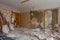 View of the vintage room with fretwork on the ceiling of the apartment and retro chandelier during under renovation, remodeling