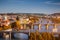 View of the Vltava River and Charle bridge with autumn red foliage, Prague, Czech Republic