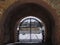 View of the Volkhov River through the arch in the wall of the Novgorod Kremlin.