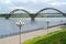 View of Volzhskaya Embankment and the arch bridge through Volga. Rybinsk, Yaroslavl region