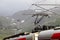 View of Voss mountain train stopped at Myrdal train station with snowy peaks on backgound, Norway