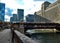View from Wacker Drive as Purple Line elevated `el` train crosses Wells Street`s elevated track over the Chicago River