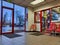 View of the waiting area inside a Discount Tire shop with a window into the maintenance area