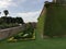 View of wall and moat of green and flowered castle