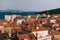 View from the wall on the roofs of the old city of Dubrovnik, the bell tower of the Dominican monastery, the dome of the