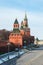 View of the walls and towers of the Moscow Kremlin with a clock on Red Square from the Bolshoi Moskvoretsky Bridge