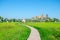 View of Wat Tham Sua with rice field and blue sky on background, Tiger cave temple most popular temple in Kanchanaburi , Thailand